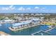 Expansive aerial view of waterfront condos, featuring private docks and serene coastal community ambiance at 7070 Placida Rd # 1230, Placida, FL 33946