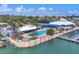 Overhead shot of a waterfront community featuring docks, a pool area, green spaces, and building architecture at 7070 Placida Rd # 1230, Placida, FL 33946