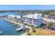 Breathtaking aerial shot of waterfront condos with private boat docks, showcasing coastal living at its finest at 7070 Placida Rd # 1230, Placida, FL 33946