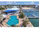 Aerial view of the pool, docks, and community gathering spaces on the waterfront of this community at 7070 Placida Rd # 1230, Placida, FL 33946