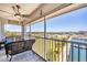 Relaxing screened balcony with comfortable seating overlooking a scenic waterfront at 7070 Placida Rd # 1230, Placida, FL 33946
