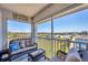 Relax on the screened balcony with beautiful views and comfortable seating, perfect for enjoying the outdoors at 7070 Placida Rd # 1230, Placida, FL 33946
