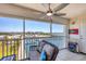 Cozy screened balcony with comfortable seating and views of the marina at 7070 Placida Rd # 1230, Placida, FL 33946