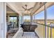 Inviting screened balcony with outdoor seating, offering a scenic outdoor experience at 7070 Placida Rd # 1230, Placida, FL 33946
