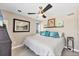 Bright bedroom featuring coastal decor and ceiling fan at 7070 Placida Rd # 1230, Placida, FL 33946