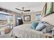 Bedroom with a bay window, a desk, and a ceiling fan at 7070 Placida Rd # 1230, Placida, FL 33946