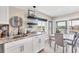 Bright kitchen and dining area with large windows and views of the water at 7070 Placida Rd # 1230, Placida, FL 33946
