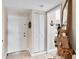 Inviting entryway with neutral tones, white door, and nautical decor at 7070 Placida Rd # 1230, Placida, FL 33946