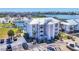 Three story condo building with parking, featuring boat storage, docks, landscaping, and inviting outdoor space at 7070 Placida Rd # 1230, Placida, FL 33946