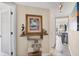 Hallway featuring coastal-themed decor, painting, and neutral flooring at 7070 Placida Rd # 1230, Placida, FL 33946