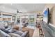Open living room with comfortable seating, balcony access, and coastal decorations at 7070 Placida Rd # 1230, Placida, FL 33946