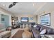 Living room featuring comfortable seating, beach-themed decor, and a ceiling fan at 7070 Placida Rd # 1230, Placida, FL 33946