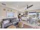 Open-concept living space with a comfortable leather sofa and dining area at 7070 Placida Rd # 1230, Placida, FL 33946