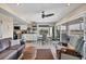Bright, open living space with modern decor and access to a screened balcony at 7070 Placida Rd # 1230, Placida, FL 33946