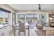 Open living and dining area with sliding glass doors to the balcony at 7070 Placida Rd # 1230, Placida, FL 33946
