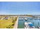 Enjoy breathtaking marina views from this waterfront property, showcasing boat slips and clear blue skies at 7070 Placida Rd # 1230, Placida, FL 33946