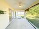The screened-in patio has a ceiling fan for added comfort during warm weather at 7193 Carvel St, Englewood, FL 34224