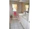 Well-maintained bathroom featuring a vanity, toilet, and shower, designed for comfort and convenience at 76 Sportsman Rd, Rotonda West, FL 33947