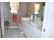 Well-maintained bathroom featuring a vanity, toilet, and shower, designed for comfort and convenience at 76 Sportsman Rd, Rotonda West, FL 33947