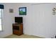 Cozy bedroom with a TV on a wooden stand and a large closet at 76 Sportsman Rd, Rotonda West, FL 33947