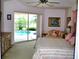 Spacious bedroom with a sliding glass door leading to the pool area at 76 Sportsman Rd, Rotonda West, FL 33947