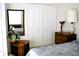 Well-furnished bedroom featuring ample storage and a mirror, designed for comfort and convenience at 76 Sportsman Rd, Rotonda West, FL 33947