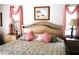 A comfortable bedroom with decorative bed frame and matching nightstands at 76 Sportsman Rd, Rotonda West, FL 33947