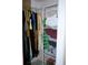 Closet with clothes hanging on racks and items stored in wire baskets at 76 Sportsman Rd, Rotonda West, FL 33947