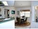 Bright dining area with a round table and views of the surrounding scenery at 76 Sportsman Rd, Rotonda West, FL 33947
