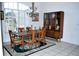 Elegant dining room with shuttered windows, decorative chandelier, and a vintage china cabinet at 76 Sportsman Rd, Rotonda West, FL 33947