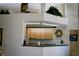 A well-maintained kitchen with light wood cabinets and a view to the upper level at 76 Sportsman Rd, Rotonda West, FL 33947