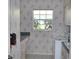 Functional laundry room with floral wallpaper and ample storage at 76 Sportsman Rd, Rotonda West, FL 33947