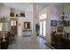 Expansive living space showing an open floorplan to the dining area and the front door at 76 Sportsman Rd, Rotonda West, FL 33947