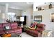 Comfortable living room features tile floors, neutral walls, and an open floor plan with clear sightlines at 76 Sportsman Rd, Rotonda West, FL 33947