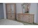 Bedroom includes an armoire and a dresser with a decorative mirror at 76 Sportsman Rd, Rotonda West, FL 33947