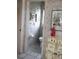 Powder room with decorative wallpaper, a small window, and a decorative statue at 76 Sportsman Rd, Rotonda West, FL 33947