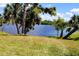 Scenic water view with lush greenery and mature trees along the shoreline at 76 Sportsman Rd, Rotonda West, FL 33947