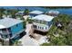 Aerial view of beautiful coastal homes surrounded by stunning tropical scenery at 8152 Little Gasparilla Is, Placida, FL 33946