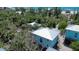 Aerial view showing coastal home location amid lush trees and nearby waterways at 8152 Little Gasparilla Is, Placida, FL 33946