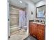 Well-lit bathroom featuring tile walls, granite counters, and modern fixtures at 8152 Little Gasparilla Is, Placida, FL 33946