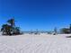 A scenic view of the beach with palm trees, calm waves, and clear blue skies at 8152 Little Gasparilla Is, Placida, FL 33946