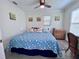 Cozy bedroom with a queen size bed, a nightstand and light wood floors at 8152 Little Gasparilla Is, Placida, FL 33946