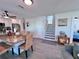 Bright dining area featuring white cabinets, granite countertops, and adjacent staircase at 8152 Little Gasparilla Is, Placida, FL 33946