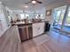 Island view of a kitchen featuring stainless steel appliances, granite countertops, and an open design at 8152 Little Gasparilla Is, Placida, FL 33946