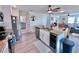 Open-concept kitchen featuring stainless steel appliances, granite countertops, and a wine cooler at 8152 Little Gasparilla Is, Placida, FL 33946