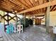 A spacious outdoor area with a bar, seating, and overhead wooden structure with rustic charm at 8152 Little Gasparilla Is, Placida, FL 33946