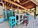 The outdoor area features a bar, seating, and an overhead wooden structure, perfect for entertaining at 8152 Little Gasparilla Is, Placida, FL 33946