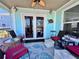 Relaxing covered patio with ample seating, a ceiling fan, and views of the outdoors at 8152 Little Gasparilla Is, Placida, FL 33946
