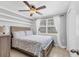 Cozy bedroom with a comfortable queen size bed, modern ceiling fan, and plenty of natural light at 832 E 4Th St, Englewood, FL 34223
