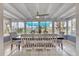 Bright dining area with large windows and tile flooring and a ceiling fan for extra comfort at 832 E 4Th St, Englewood, FL 34223